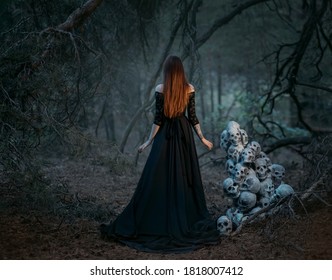 Mysterious silhouette of a ghost woman in a black vintage long dress. Gothic pagan lady near many skulls of dead people. The vampire walks in a deep dark mystical forest. Back rear view.