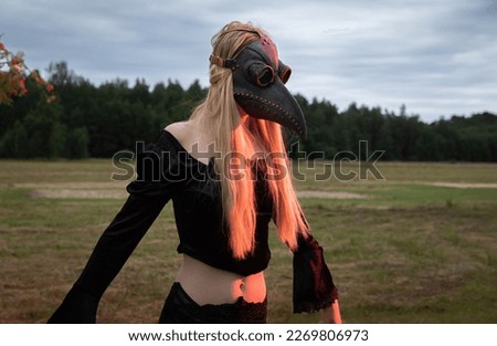 A mysterious and surreal portrait of a young woman in a plague mask.