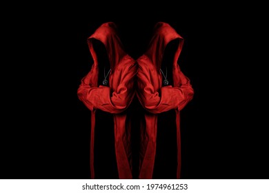 Mystery cult members in a red hooded cloaks in the dark. Unrecognizable person. Hiding face in shadow. Ghostly figure. Sectarian. Conspiracy concept.	 - Shutterstock ID 1974961253