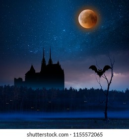 Mystic dark castle in forest, halloween background. Night landscape with stars and bloody moon