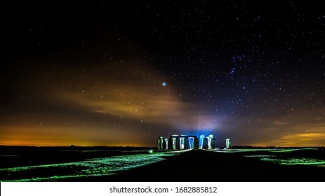 Mystic Looking Lights At A Starry Night At Stonehenge In Wiltshire, Great Britain.