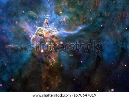 Mystic Mountain of Carina Nebula. Deep space look. Science fiction wallpaper. Elements of this image were furnished by NASA.