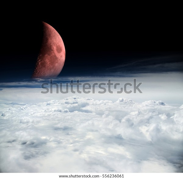 mystic scene from outer space\
with moon and clouds of the Earth (edited from personal images of\
moon with telephoto lens and a photo of clouds taken from\
airplane)