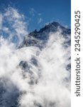 mystical clouds around the peak of Grand Cornier