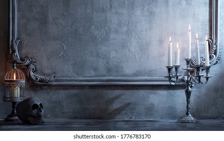 Mystical Halloween still-life background. Skull, candlestick with candles, old fireplace. Horror and witchery. - Shutterstock ID 1776783170