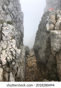 A mystical mountain crevice in the fog.