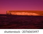 Mystical seaside with rocks. The magic and beauty of the sea. Surrealistic art infrared photo