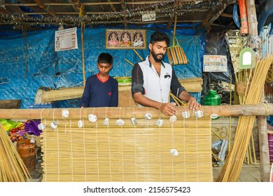 Mysuru, Karnataka, India-May 14 2022;   A Traditional method of weaving eco friendly bamboo screens by the farmers in Karnataka, India.  

