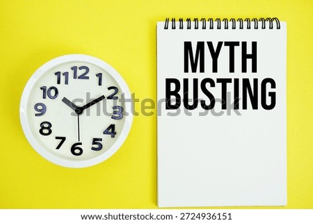 Myth Busting text with alarm clock flat lay on yellow background