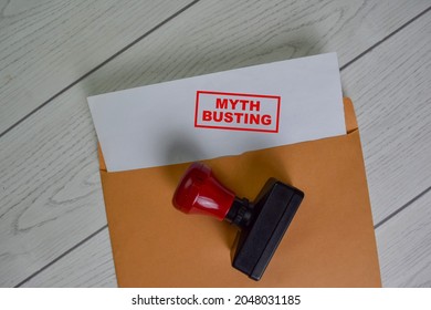 Myth Busting text on document above brown envelope.