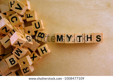 Myths word cube on wood background ,English language learning concept