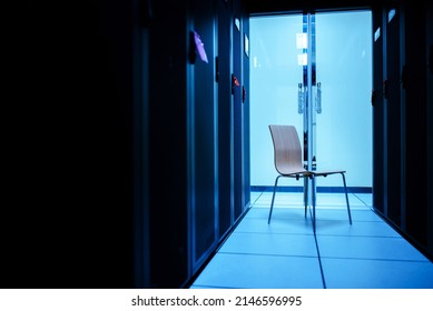 n empty chair in the server room represents a job title. - Powered by Shutterstock