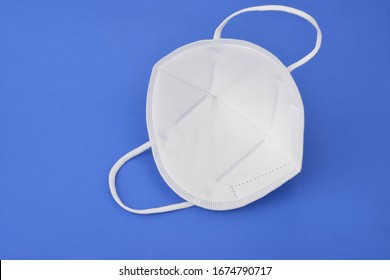  A N95 Mask On A Blue Background, Concept Of Covid-19