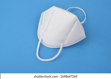 A N95 Mask On A Blue Background, Concept Of Covid-19