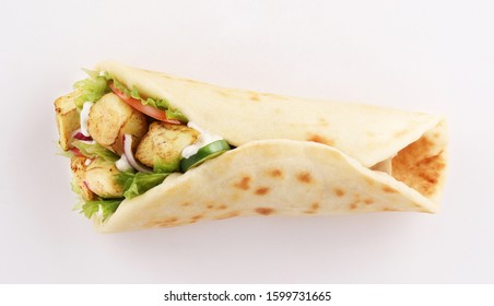 naan bread wrap sandwich shish taouk, curry tandoori with tomato and red onion, top view isolated on white background
