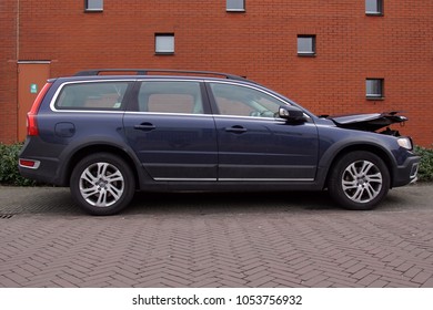 Naarden, Gooise Meren, The Netherlands - March 23, 2018: Volvo V70 With Accident Damage Parked By The Side Of The Road. Nobody In The Vehicle.