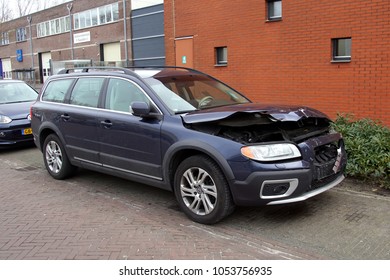 Naarden, Gooise Meren, The Netherlands - March 23, 2018: Volvo V70 With Accident Damage Parked By The Side Of The Road. Nobody In The Vehicle.