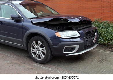 Naarden, Gooise Meren, The Netherlands - March 25, 2018: Volvo V70 With Accident Damage Parked By The Side Of The Road. Nobody In The Vehicle