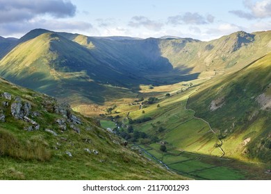 The Nab, Rest Dodd, Brock Crags and Heck Crag in warm sunlight above Bannerdale Beck in Martindale in the English Lake District, England, UK. - Shutterstock ID 2117001293