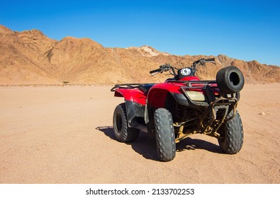 Nabq, Egypt - 12.22.2021: ATVs On Egyptian Sand Desert. Quad Bike In Nabq Protected Area Near Mountains, Sharm El Sheikh, Sinai, Egypt. Safari, Egyptian Excursion, Off-road ATV Adventures In A Desert