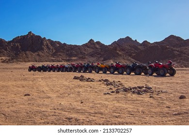 Nabq, Egypt - 12.22.2021: ATVs On Egyptian Sand Desert. Quad Bike In Nabq Protected Area Near Mountains, Sharm El Sheikh, Sinai, Egypt. Safari, Egyptian Excursion, Off-road ATV Adventures In A Desert