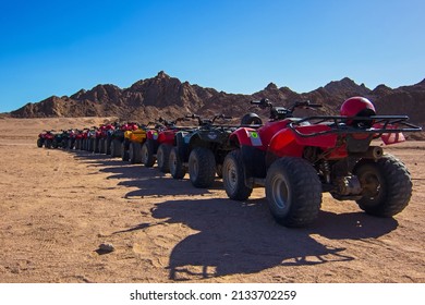 Nabq, Egypt - 12.22.2021: ATVs On Egyptian Sand Desert. Quad Bike In Nabq Protected Area Near Mountains, Sharm El Sheikh, Sinai, Egypt. Safari, Egyptian Excursion, Off-road ATV Adventures In A Desert