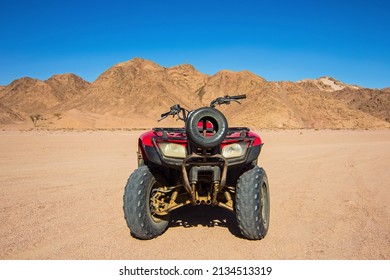 Nabq, Egypt - 12.22.2021: ATVs On Egyptian Sand Desert Near Mountains. Quad Bike In Nabq Protected Area, Sharm El Sheikh, Sinai, Egypt. Safari, Egyptian Excursion, Off-road ATV Adventures In A Desert