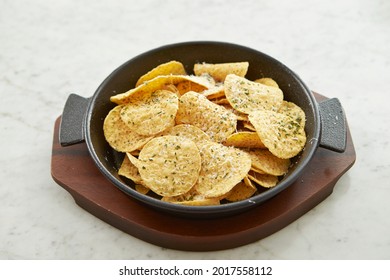Nacho Chips Sprinkled with Cheese on a Plate