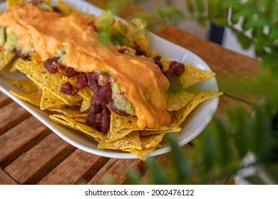 Nachos With Cheddar Cheese Guacamole Beans