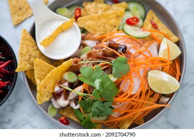 Nachos Chips With Shredded Barbecue Chicken, Vegetables, Greens And Dip Sauce, Middle Close-up, Selective Focus