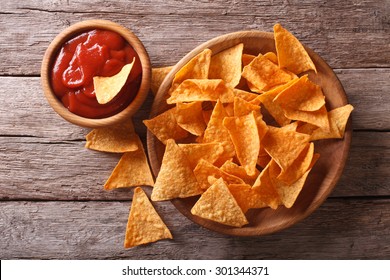 Nachos Corn Chips With Spicy Sauce On The Table. Horizontal View From Above
