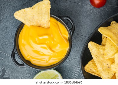 Nachos Corn Tortilla Chip With Cheese Dip Sauce, On Gray Background, Top View Or Flat Lay