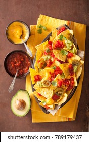 Nachos Loaded With Salsa, Cheese And Jalapeno