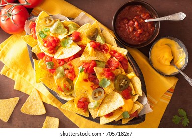 Nachos Loaded With Salsa, Guacamole, Cheese And Jalapeno