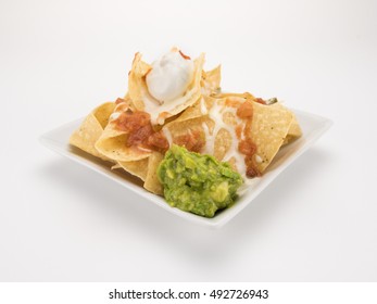 Nachos With Queso, Salsa, And Guacamole Isolated On White