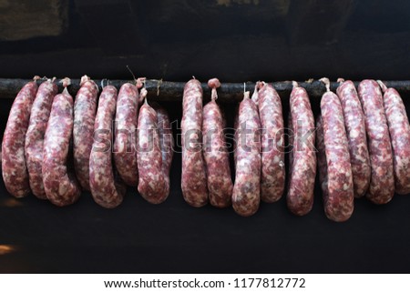 Nadenitsa - traditional Bulgarian homemade spicy sausages hanging on a stick. Sujuk - popular in all Balkan countries spicy sausages.