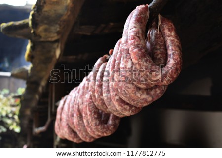 Nadenitsa - traditional Bulgarian homemade spicy sausages hanging on a stick. Sujuk - popular in all Balkan countries spicy sausages.