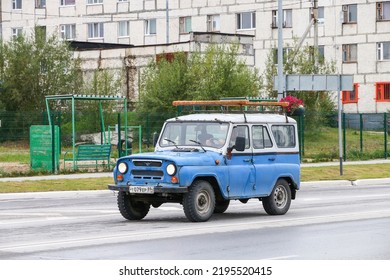 Nadym, Russia - August 13, 2022: Cyan Offroad Car UAZ-31519 In The City Street.