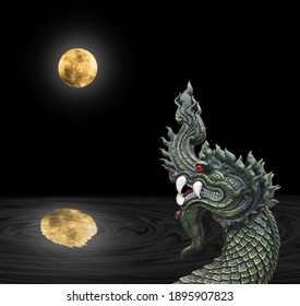 Naga Head The King Of Sneak Serpent Statue With Fullmoon Reflection In River At Night, Phayanak Or Naga Statue In Thailand