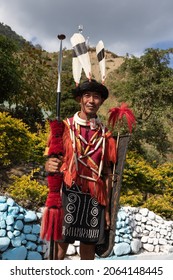 A Naga tribesman dressed in traditional attire with traditional weapons at Kohima Nagaland India on 4 December 2016
