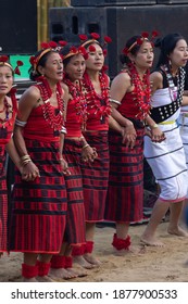 Naga women dancing wearing their traditional ethnic attire in Kisama heritage village in Nagaland India during hornbill festival on 4 December 2016