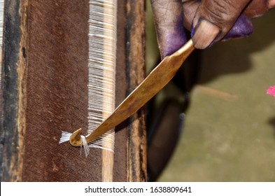 Nagaon/India - Feb 08 2020: An Indian Woman Busy In Her Weaving Work At Petuboha Village In Nagaon District Of India's North Eastern States Assam.