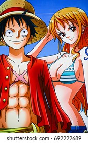 Nagasaki, Japan - May 13, 2013 : Photo of Monkey D.Luffy and Nami from Japanese manga and animation One Piece in Nagasaki Huis Ten Bosch. Luffy is the leader of a Straw hat pirate team.