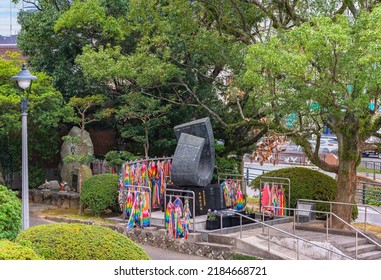 Nagasaki, Kyushu - December 11 2021: Atomic Bomb Memorial Monuments Of The Nagasaki Peace Park Offered By The Association Of Japan Telecommunications Worker And The Construction Worker Craftsmans.