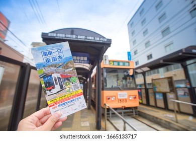 Nagasaki, Kyushu, Japan - Dec 05, 2019: Nagasaki Travel With One Day Free Pass, For Streetcar, Tram, Bus. With Streetcar Background.