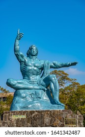 Nagasaki Prefecture, Japan - JAN 2 2020 : Peace Statue in Nagasaki Peace Park in sunny day. A historical park commemorating the atomic bombing of the city on August 9, 1945 during World War II