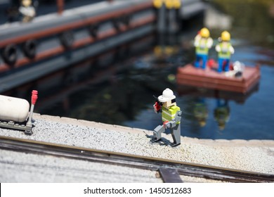 Nagoya, Japan - April 08, 2019: Lego Art Model Of Construction Worker Phone Near Canal At Japan Legoland. Famous Theme Park Landmark Espcially For Children Age Around 1 To 7 Years Old.