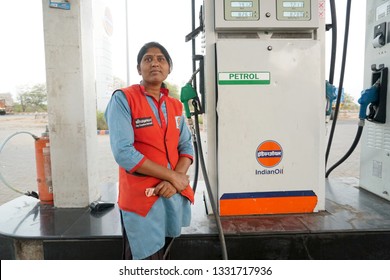 NAGPUR, MAHARASHTRA, INDIA - 04 MARCH 2019: Unidentified Indian Woman Pumping Gasoline Fuel At Gas Station. Concept Of Women Empowerment . 