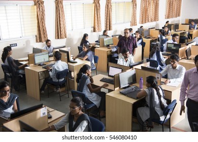 NAGPUR, MAHARASHTRA, INDIA, 11 APRIL 2016 : Unidentified Young Students Of Information Technology Using Computers For Taking Information  For Their Study.