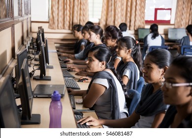 NAGPUR, MAHARASHTRA, INDIA, 11 APRIL 2016 : Unidentified Young Students Of Information Technology Using Computers For Taking Information  For Their Study.